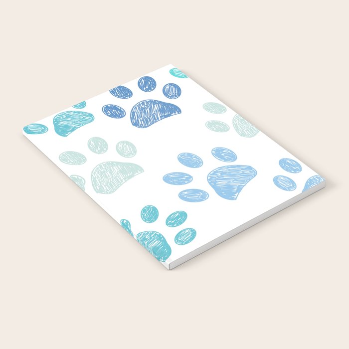 Blue colored paw print background Notebook