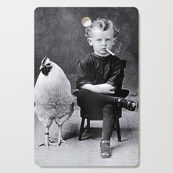 Smoking Boy with Chicken black and white photograph - photography - photographs Cutting Board Gallery Image 1