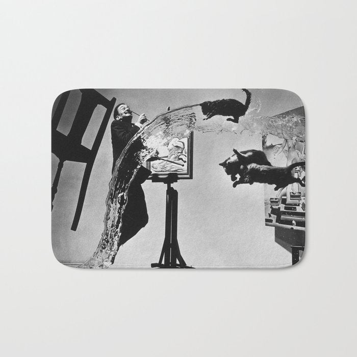 Dalí Atomicus, Salvador Dali painting with flying cats and water spurts surrealism / surrealist black and white photograph / photography by Philippe Halsman Bath Mat Gallery Image 1