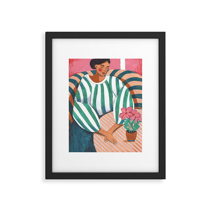 Woman in stripes in thought Framed Art Print