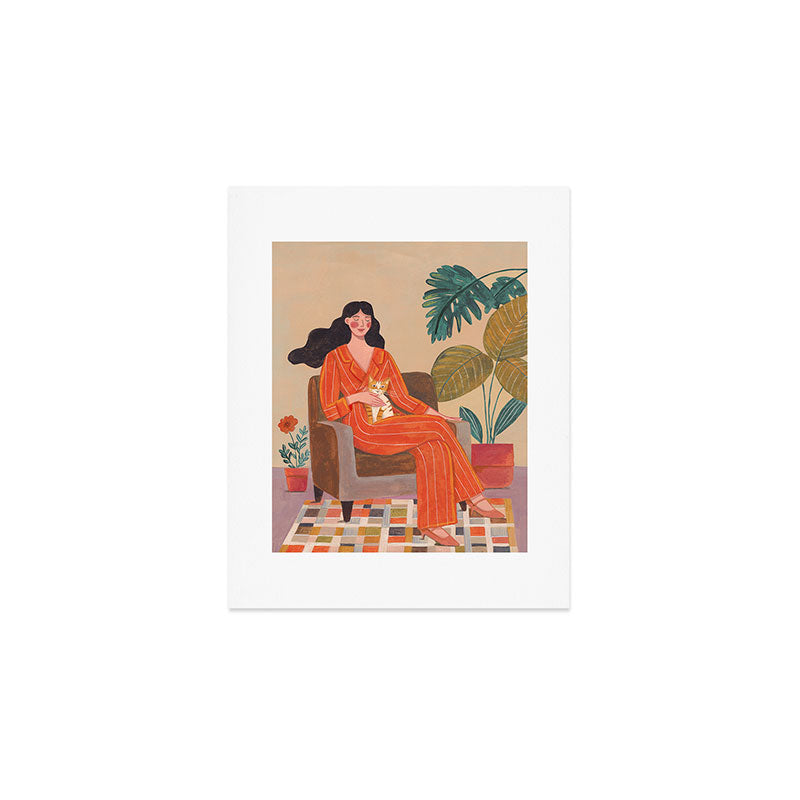 Woman with cat in living room in warm earth tones Art Print