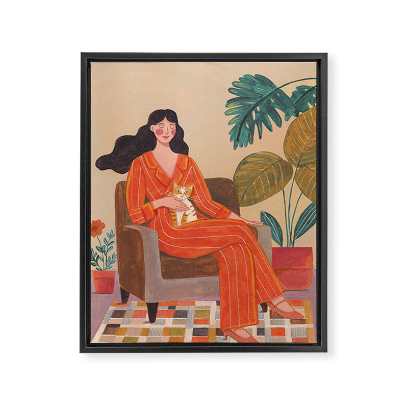 Woman with cat in living room in warm earth tones Framed Canvas Print Gallery Image 3