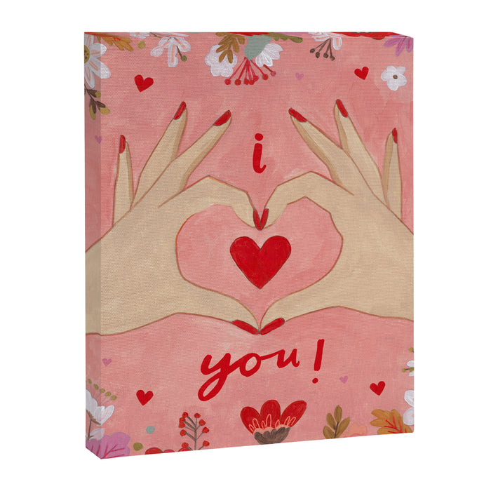 Women hands making love sign Canvas Print Gallery Image 1