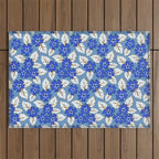 Tossed sakura flowers in blue Outdoor Rug Gallery Image 1