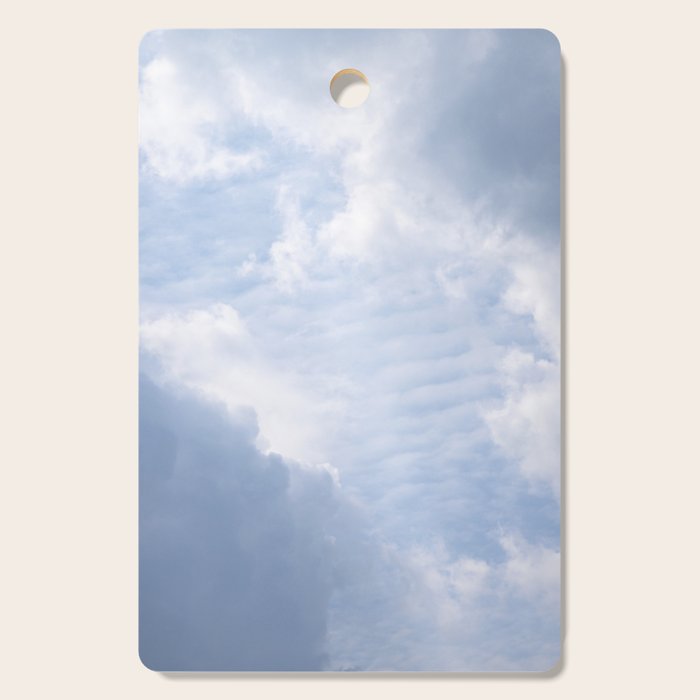 A pattern in the clouds in a blue sky on a summer day - dreamy clouds nature and travel photography Cutting Board Gallery Image 1