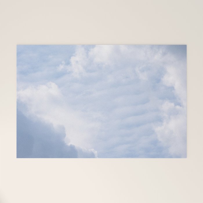 A pattern in the clouds in a blue sky on a summer day - dreamy clouds nature and travel photography Welcome Mat Gallery Image 1