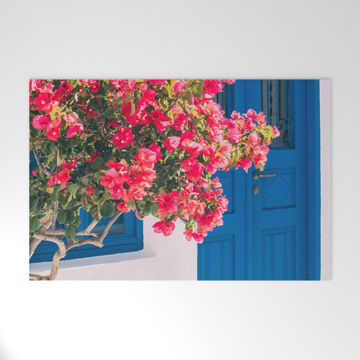 Blue Door in Santorini Greece - Pink Flowers by House - Fine Art Travel Photography Welcome Mat Gallery Image 1