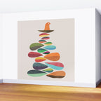 Bird nesting on top of pebbles hill Wall Mural Gallery Image 2