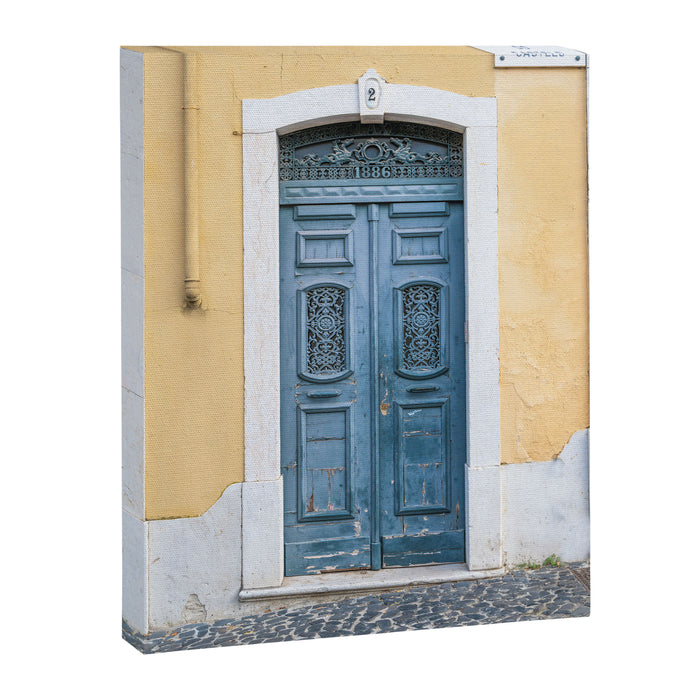 The blue door number 2 in Lisbon Portugal  Summer street and travel photography Canvas Print Gallery Image 1
