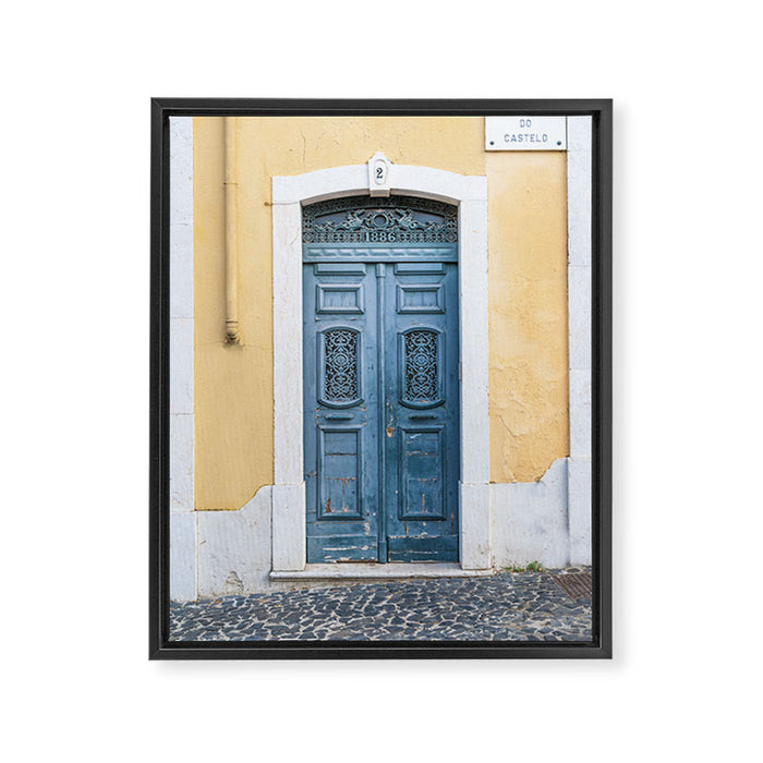 The blue door number 2 in Lisbon Portugal  Summer street and travel photography Framed Canvas Print Gallery Image 1
