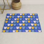 Rows of Tulips in Bloom in Blue & Mustard Yellow Rug Gallery Image 1