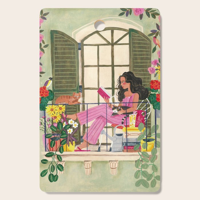 Woman reading on balcony Cutting Board Gallery Image 1