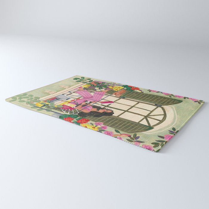 Woman reading on balcony Rug Gallery Image 3