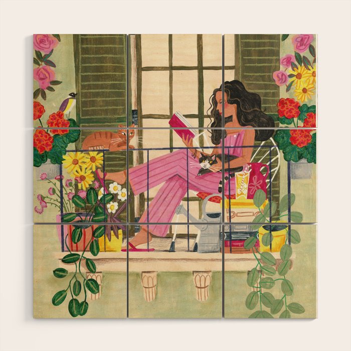 Woman reading on balcony Wood Wall Art Gallery Image 1