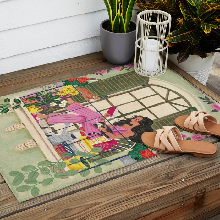 Woman reading on balcony Outdoor Rug Gallery Image 2