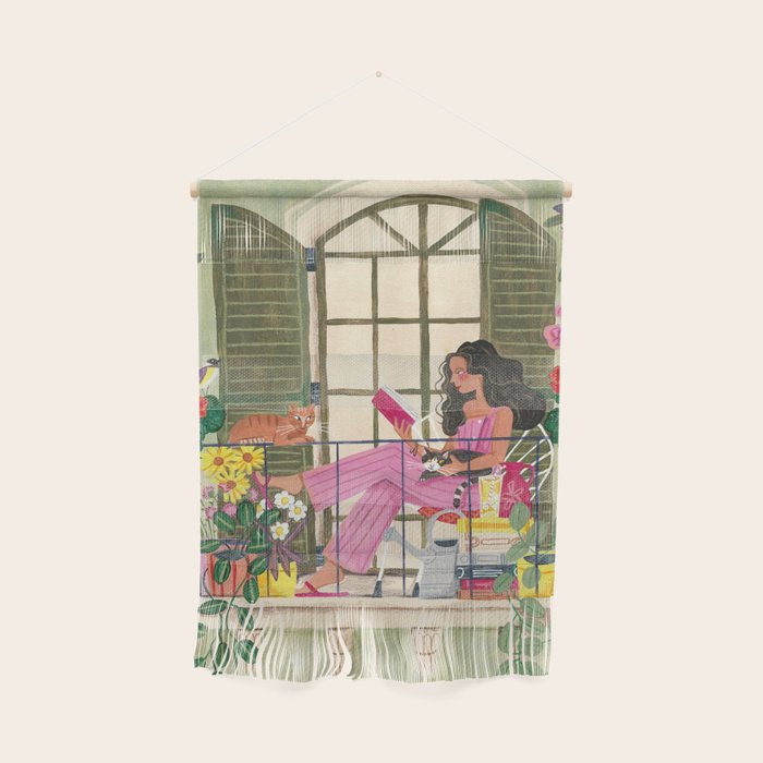 Woman reading on balcony Wall Hanging Gallery Image 1