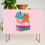 One more chapter // pastel pink background orange tabby cat striped mug with plants fuchsia pink and green books  Credenza Gallery Image 1