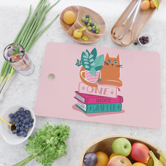 One more chapter // pastel pink background orange tabby cat striped mug with plants fuchsia pink and green books  Cutting Board Gallery Image 2