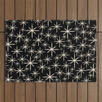 Twinkling Mid Century Modern Starburst Pattern Black and Cream Outdoor Rug Gallery Image 1