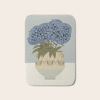 bouquet of lush blue hydrangeas in a vase on a blue background Bath Mat Gallery Image 1