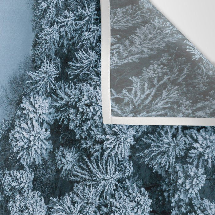 Man lying in the snow on a frozen lake in a winter forest - Landscape Photography Wall Tapestry Gallery Image 3