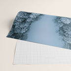 Man lying in the snow on a frozen lake in a winter forest - Landscape Photography Wrapping Paper Gallery Image 2