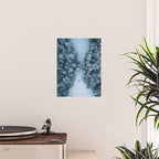 Man lying in the snow on a frozen lake in a winter forest - Landscape Photography Poster Gallery Image 2