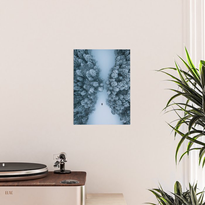 Man lying in the snow on a frozen lake in a winter forest - Landscape Photography Poster Gallery Image 2