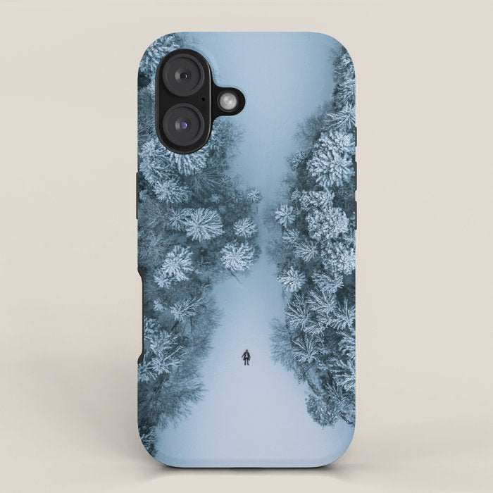 Man lying in the snow on a frozen lake in a winter forest - Landscape Photography iPhone Case Gallery Image 1