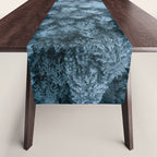 Man lying in the snow on a frozen lake in a winter forest - Landscape Photography Table Runner Gallery Image 1