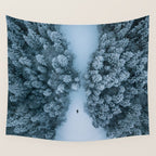 Man lying in the snow on a frozen lake in a winter forest - Landscape Photography Wall Tapestry Gallery Image 4