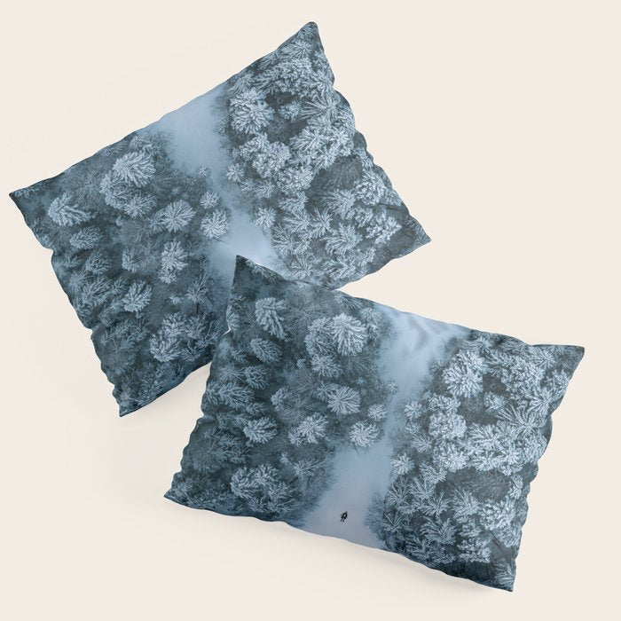 Man lying in the snow on a frozen lake in a winter forest - Landscape Photography Pillow Sham Gallery Image 1