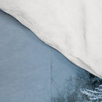 Man lying in the snow on a frozen lake in a winter forest - Landscape Photography Comforter Gallery Image 4