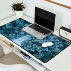 Man lying in the snow on a frozen lake in a winter forest - Landscape Photography Desk Mat Gallery Image 2
