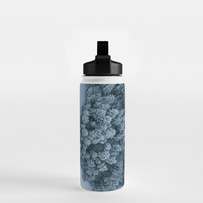 Man lying in the snow on a frozen lake in a winter forest - Landscape Photography Water Bottle Gallery Image 2