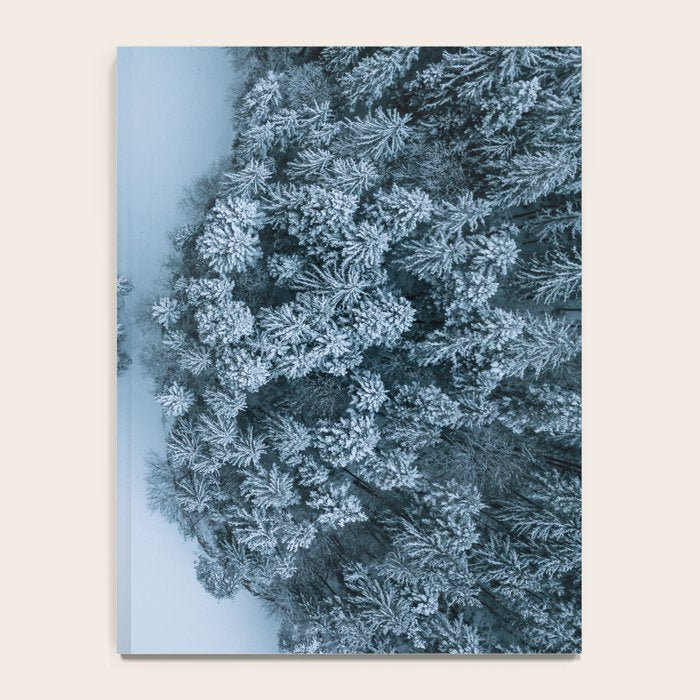 Man lying in the snow on a frozen lake in a winter forest - Landscape Photography Notebook Gallery Image 4