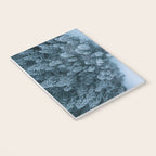 Man lying in the snow on a frozen lake in a winter forest - Landscape Photography Notebook Gallery Image 3