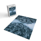 Man lying in the snow on a frozen lake in a winter forest - Landscape Photography Jigsaw Puzzle Gallery Image 2