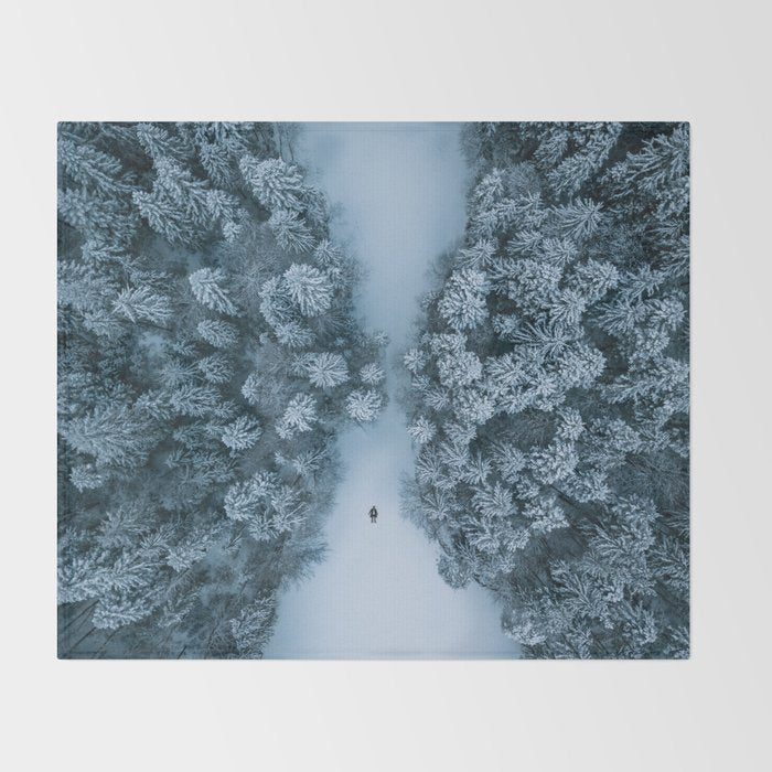 Man lying in the snow on a frozen lake in a winter forest - Landscape Photography Throw Blanket Gallery Image 2