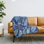 Tropical palm leaves pattern in blue Throw Blanket Gallery Image 1