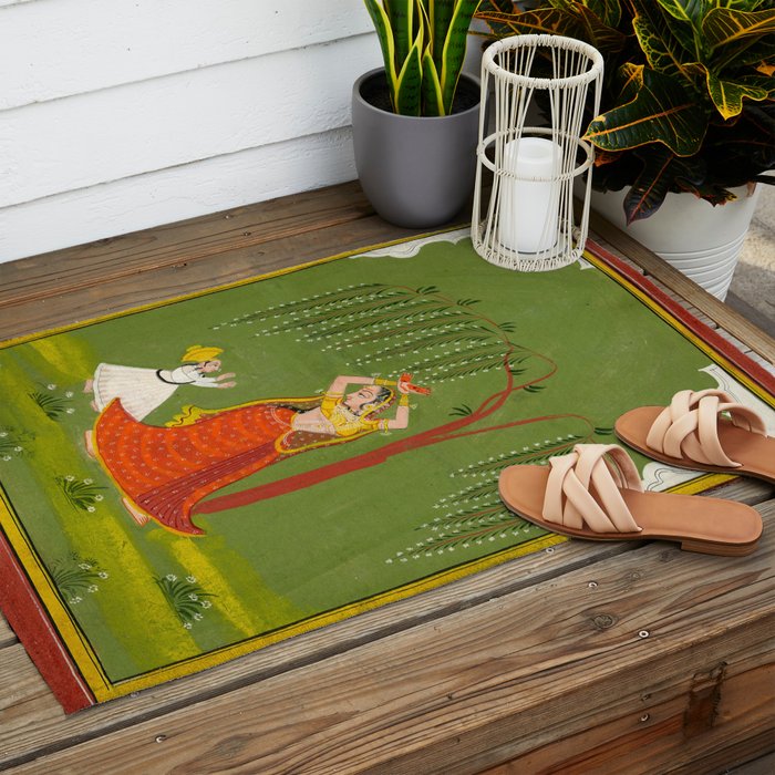 A female attendant is standing in tribhanga pose under a tree. A small child vies for her attention. Outdoor Rug Gallery Image 2