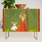 A female attendant is standing in tribhanga pose under a tree. A small child vies for her attention. Credenza Gallery Image 1