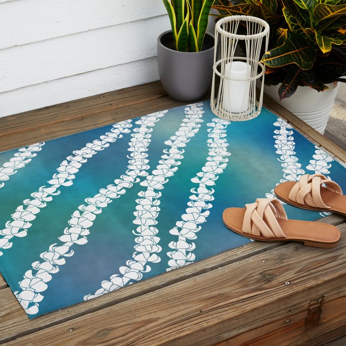 Puakenikeni single lei art on blue Outdoor Rug Gallery Image 2