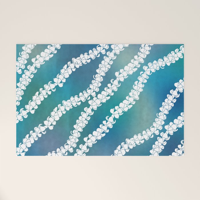 Puakenikeni single lei art on blue Welcome Mat Gallery Image 1