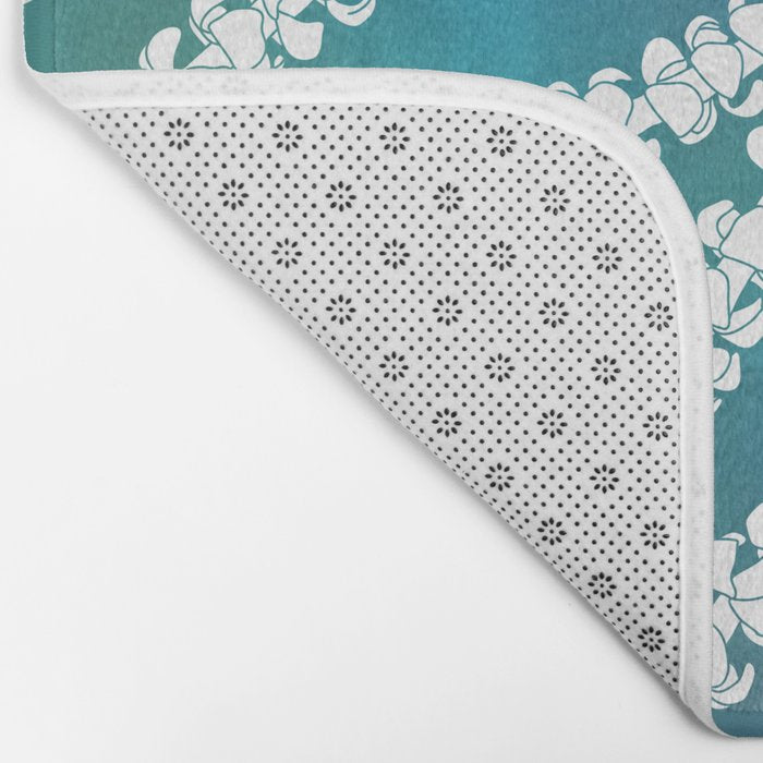 Puakenikeni single lei art on blue Bath Mat Gallery Image 2