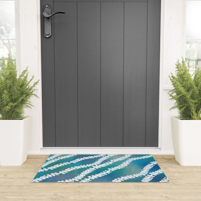 Puakenikeni single lei art on blue Welcome Mat Gallery Image 3