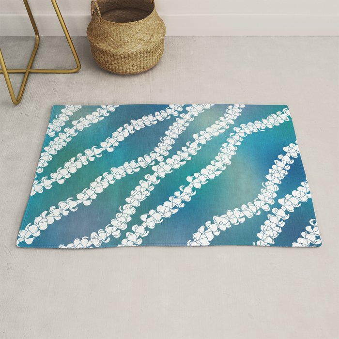 Puakenikeni single lei art on blue Rug Gallery Image 1