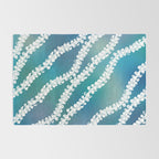Puakenikeni single lei art on blue Rug Gallery Image 2