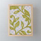 Vibrant Green Leaves on a Blue Checkered Background Mini Art Print Gallery Image 1