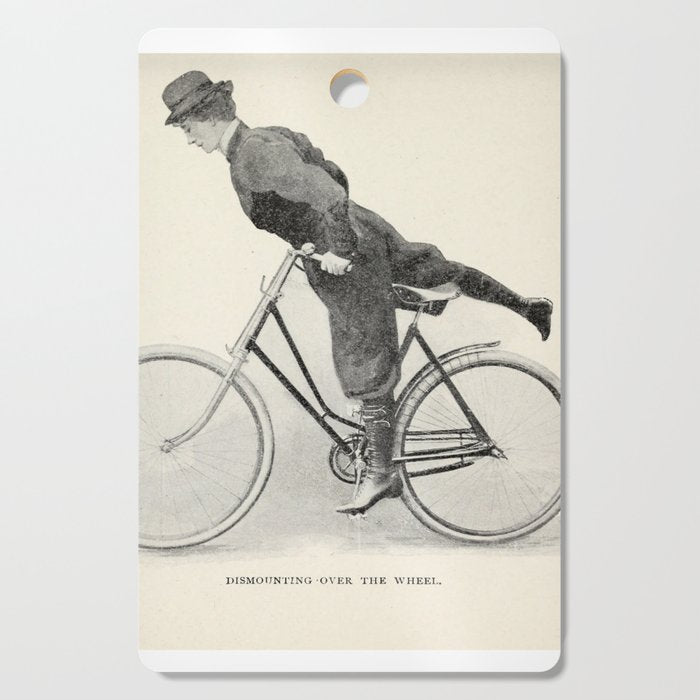 "Dismounting Over the Wheel" from "Bicycling for Ladies" by Maria E. Ward, 1896 Cutting Board Gallery Image 1